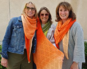 The group models their 'FOL-07_04 Lang Yarns Puno' by LangYarns Switzerland.